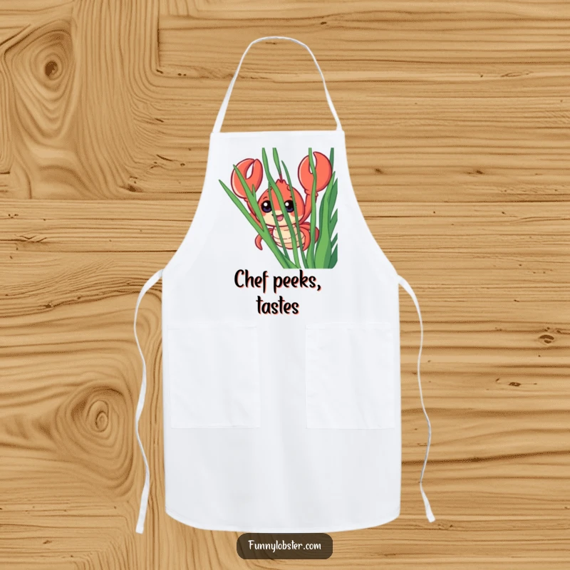 Funny apron showing a smiling lobster with large eyes peeking from behind seaweed, adding a humorous touch to cooking duties.